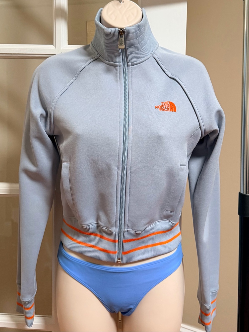 The North Face Light Blue/gray Cropped Jacket with Orange Accents